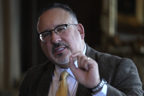 U.S. Education Secretary Miguel Cardona participates in a roundtable discussion with students from Dartmouth College, Wednesday, Jan. 10, 2024, on the school&#039;s campus in Hanover, N.H. Fallout fro ...