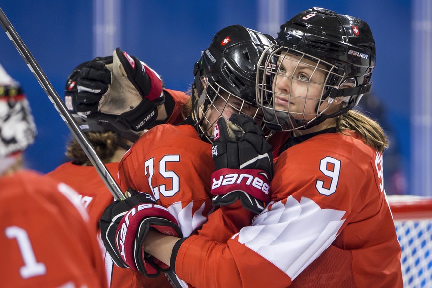 Alina Muller of Switzerland, and Shannon Sigrist of Switzerland, from left, react after the women ice hockey quarter final match between the team of Olympic Athletes of Russia (OAR) and Switzerland in ...