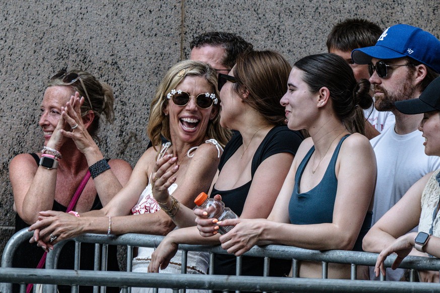 epa13084697 Taylor Swift fans, known as 'Swifties,' wait outside Madison Square Garden hoping to catch a glimpse of the singer as guests arrive for Taylor Swift and Travis Kelce's weddi ...