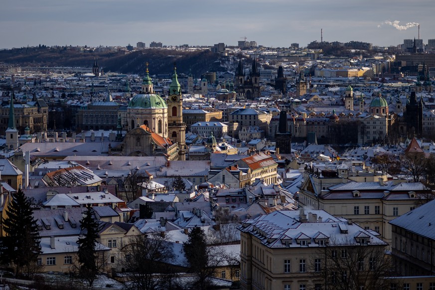 epa12622808 A view of the snow-covered city center of in Prague, Czech Republic, 03 January 2026. EPA/MARTIN DIVISEK