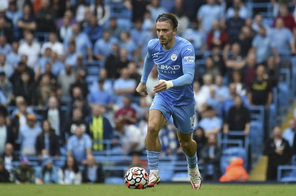 Manchester City&#039;s Jack Grealish in action during the English Premier League soccer match between Manchester City and Norwich City at Etihad stadium in Manchester, England, Saturday, Aug. 21, 2021 ...