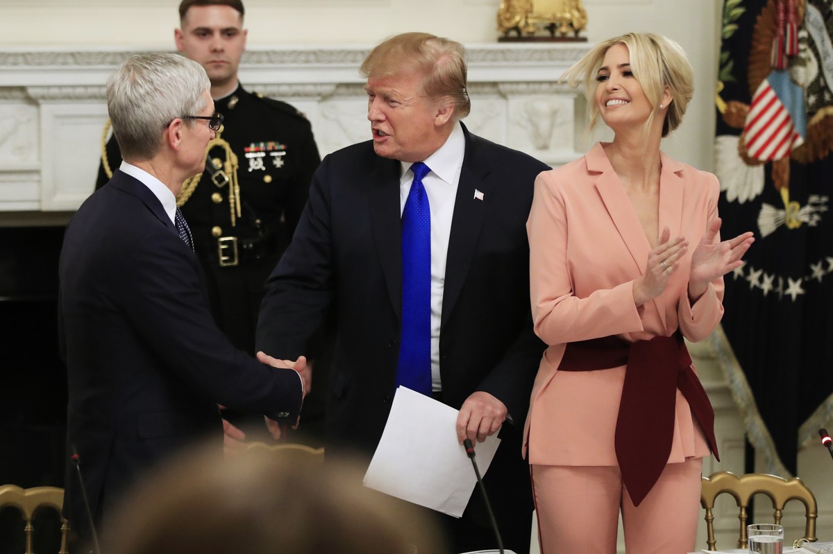 President Donald Trump with American Workforce Policy Advisory Board co-chair Ivanka Trump, right, greets Apple Inc. CEO Tim Cook, during the advisory board's first meeting in the State Dining Ro ...