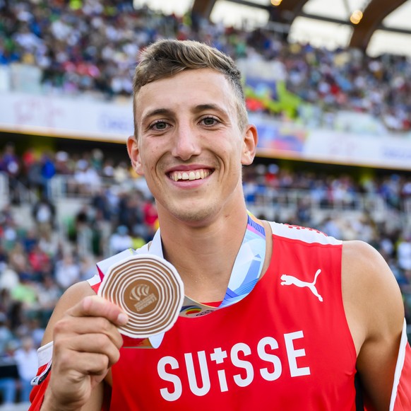 Bronze medalist Simon Ehammer of Switzerland celebrates for the men&#039;s long jump final during the IAAF World Athletics Championships, at the Hayward Field stadium, in Eugene, United States, Saturd ...