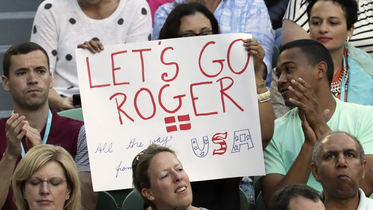 A fan holds up a banner in support of Switzerland&#039;s Roger Federer during his quarterfinal against Germany&#039;s Mischa Zverev at the Australian Open tennis championships in Melbourne, Australia, ...