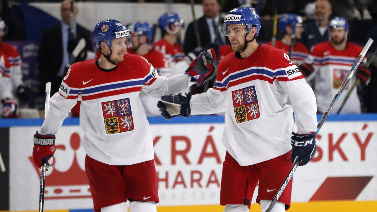 Czech Republic's Jan Rutta, right, celebrates after scoring his sides third goal with teammate Roman Cervenka, left, during the Ice Hockey World Championships group B match between France and Cze ...