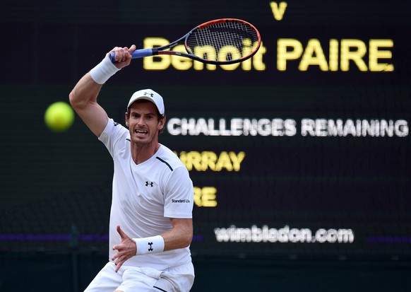 epa06079601 Andy Murray of Britain returns to Benoit Paire of France in their fourth round match during the Wimbledon Championships at the All England Lawn Tennis Club, in London, Britain, 10 July 201 ...