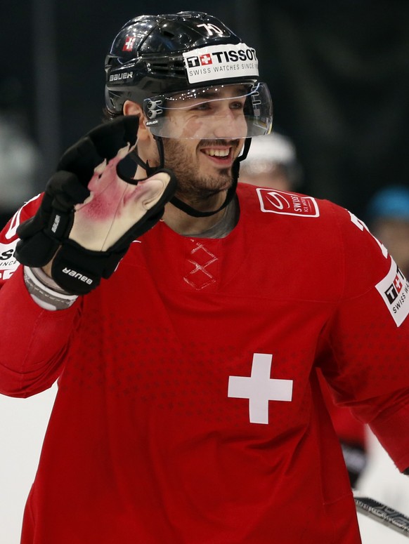 Switzerland forward Denis Hollenstein celebrates a goal during the Group B preliminary round match between Switzerland and Latvia at the Ice Hockey World Championship in Minsk, Belarus, Tuesday, May 2 ...