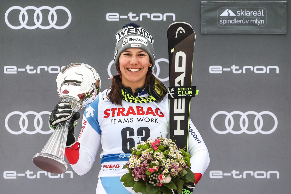 epa07424573 Second placed Wendy Holdener of Switzerland celebrates on the podium during trophy ceremony of Women's Slalom race at the FIS Alpine Skiing World Cup in Spindleruv Mlyn, Czech Republi ...