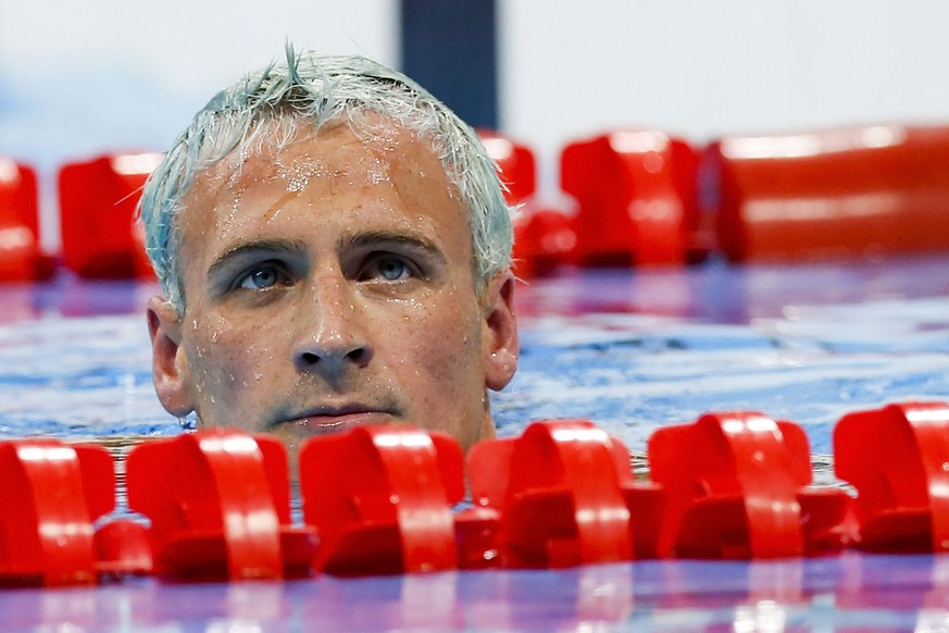 epa05476156 Ryan Lochte of the USA reacts after competing in the men&#039;s 200m Individual Medley Final of the Rio 2016 Olympic Games Swimming events at Olympic Aquatics Stadium at the Olympic Park i ...