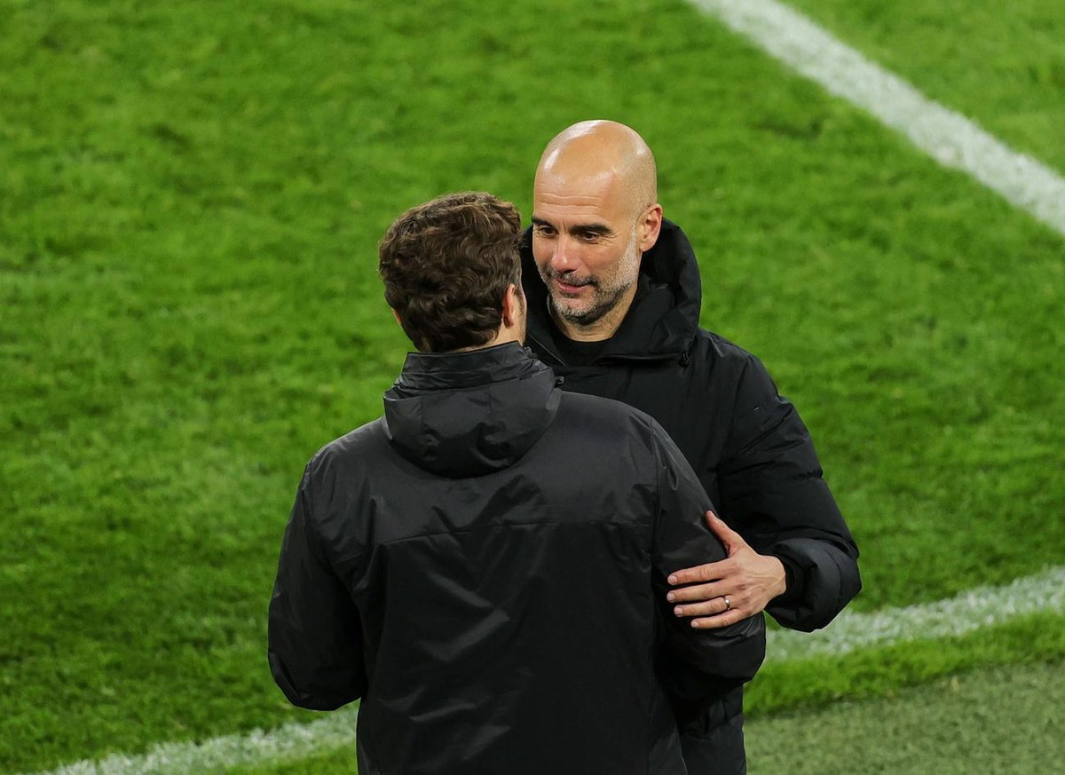 epa09135936 Dortmund coach Edin Terzic (L) talks to Manchester City manager Pep Guardiola after the UEFA Champions League quarter final, second leg soccer match between Borussia Dortmund and Mancheste ...