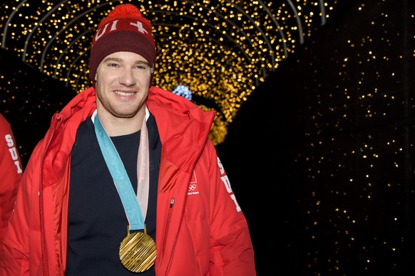 Gold medal, Dario Cologna of Switzerland arrives at the House of Switzerland after the men Cross-Country Skiing 15 km free race during the XXIII Winter Olympics 2018 in Pyeongchang, South Korea, on Fr ...