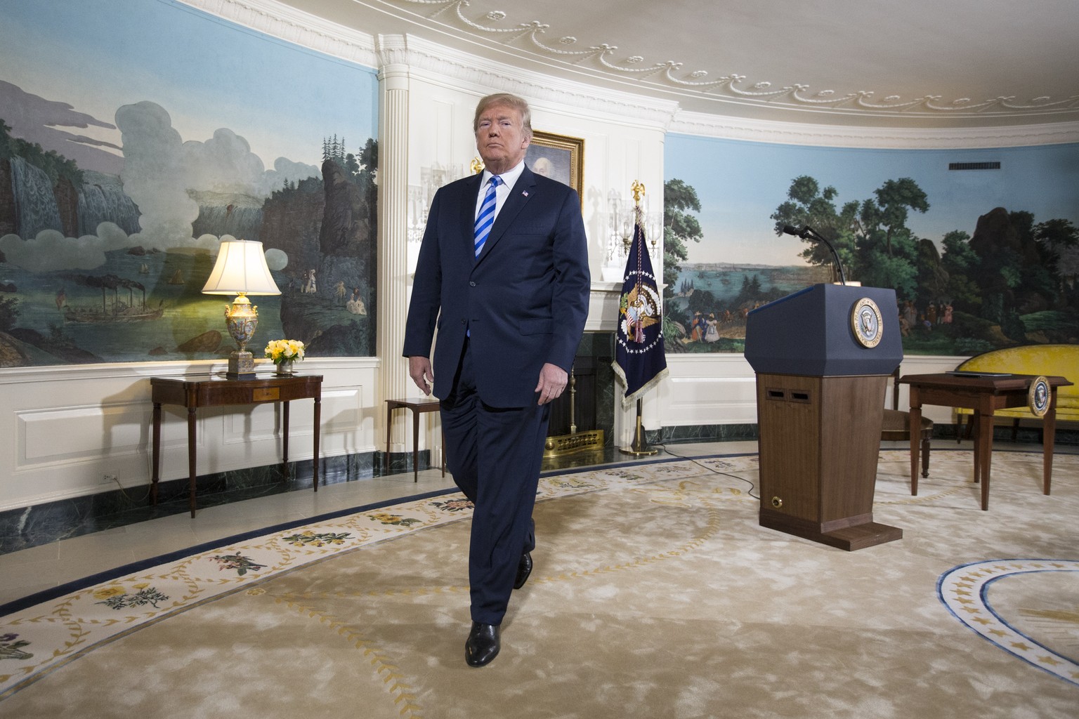 epa06719990 US President Donald J. Trump departs after delivering an announcement on Iran and signing a presidential memorandum in the Diplomatic Reception Room of the White House in Washington, DC, U ...