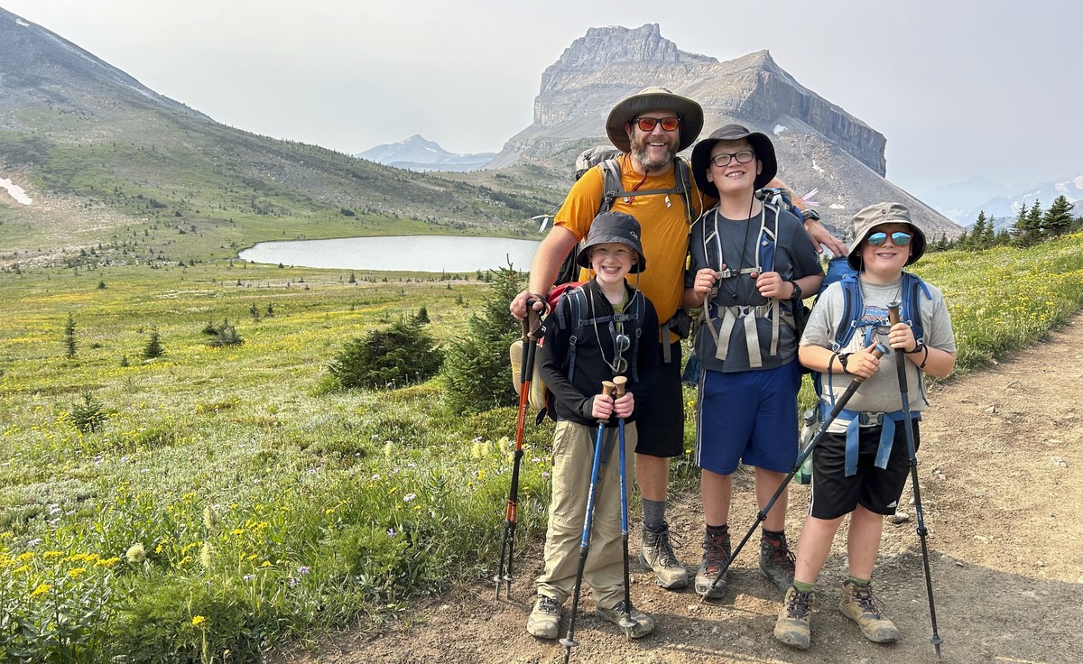 This undated photo shows the Campbell family, wearing sun protection shirts and hats, posing for a photo during a hike in the Rocky Mountains near their Calgary, Alberta home, (Lynn Campbell via AP)
H ...
