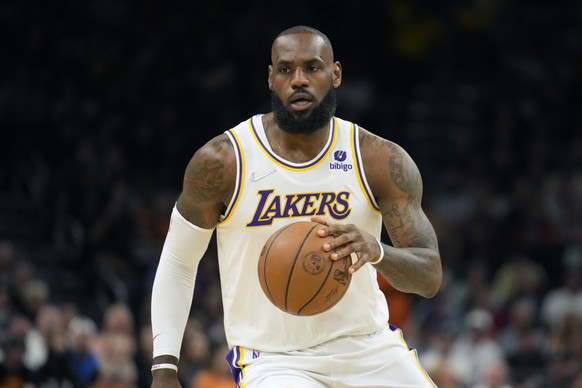 FILE -Los Angeles Lakers forward LeBron James (6) during the first half of an NBA basketball game against the Phoenix Suns, Sunday, Jan. 13, 2022, in Phoenix. LeBron James and Naomi Osaka are becoming ...