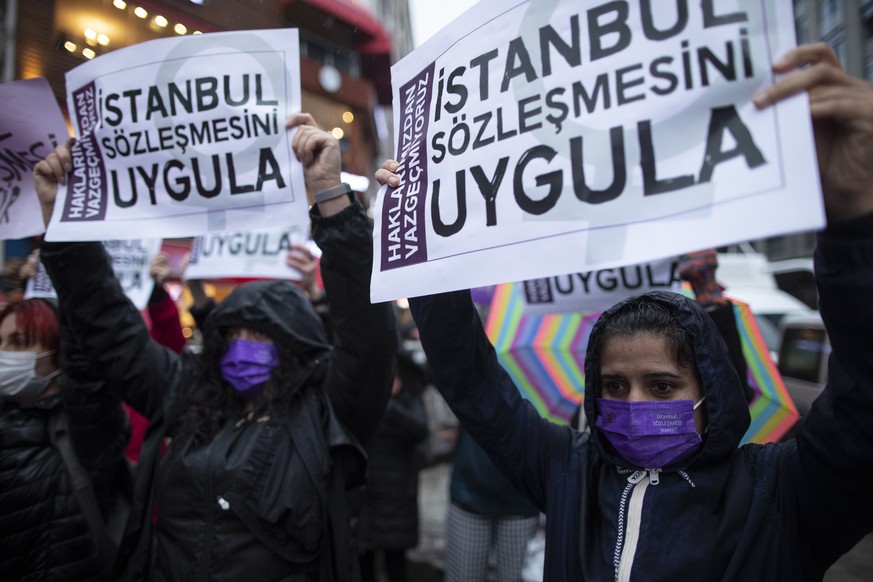 epaselect epa09090476 Women shout slogans and hold placards reading on&#039; Apply the Istanbul Convention&#039; during a protest against Turkey&#039;s withdraw decision from Istanbul Convention in Is ...