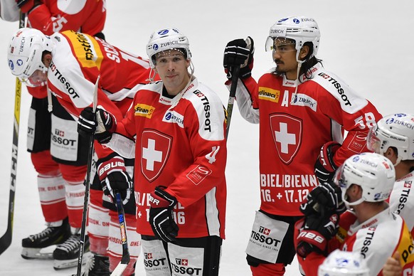 Switzerland&#039;s Reto Schaeppi, Patrick Geering and Eric Blum, from left, are disapointed after the game against Canada during the Ice Hockey Deutschland Cup at the Curt-Frenzel-Eisstadion in Augsbu ...