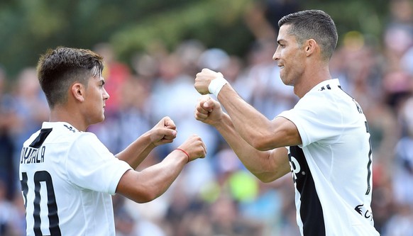 epa06946094 Juventus&#039; Cristiano Ronaldo (R) celebrates with teammate Paulo Dybala during a soccer friendly match between Juvents A and Juventus B at Villar Perosa, Turin, 12 August 2018. EPA/ALES ...