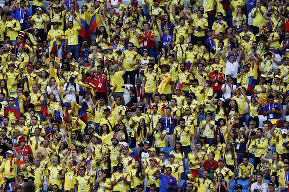 Columbian supporters watch the group H match between Senegal and Colombia, at the 2018 soccer World Cup in the Samara Arena in Samara, Russia, Thursday, June 28, 2018. (AP Photo/Efrem Lukatsky)