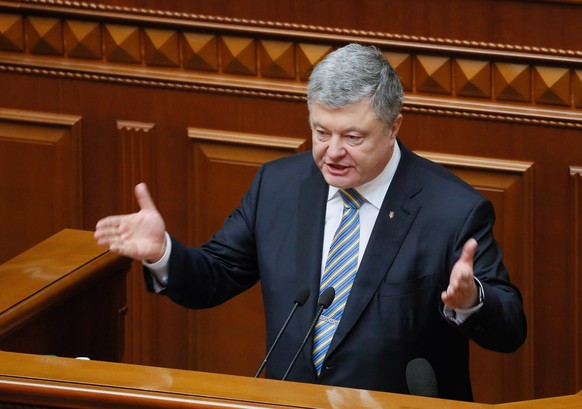 epa07380706 Ukrainian President Petro Poroshenko speaks to lawmakers during an extraordinary session of Ukrainian Parliament in Kiev, Ukraine, 19 February 2019. Poroshenko signed a law on amending the ...