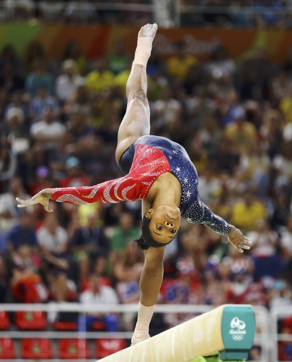 2016 Rio Olympics - Artistic Gymnastics - Preliminary - Women's Qualification - Subdivisions - Rio Olympic Arena - Rio de Janeiro, Brazil - 07/08/2016. Gabrielle Douglas (USA) of USA (Gabby Douglas) competes on the beam during the women's qualifications.   REUTERS/Mike BlakeFOR EDITORIAL USE ONLY. NOT FOR SALE FOR MARKETING OR ADVERTISING CAMPAIGNS.  