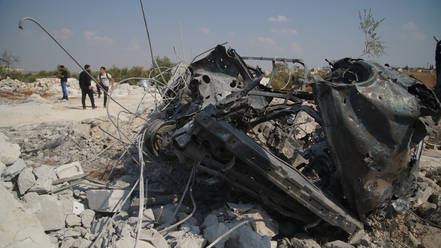 epa07955661 A view of burnt and twisted metal at the site that was hit by helicopter gunfire which reportedly killed nine people, including Abu Baker al-Baghdadi, the leader of IS or so-called Islamic ...