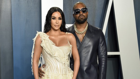 FILE -Kim Kardashian West, left, and Kanye West arrive at the Vanity Fair Oscar Party in Beverly Hills, Calif. on Feb. 9, 2020. Kardashian West is asking the public to show compassion and empathy to h ...