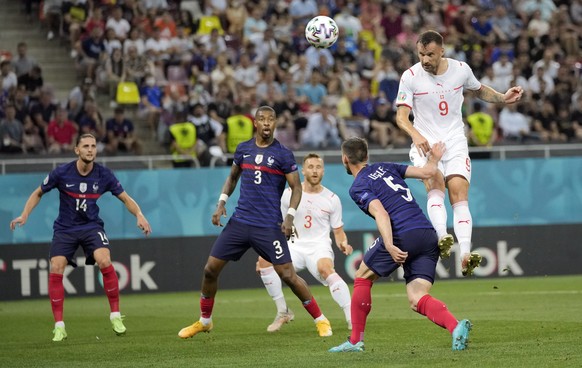 epa09309204 Haris Seferovic (R) of Switzerland scores the 0-1 goal during the UEFA EURO 2020 round of 16 soccer match between France and Switzerland in Bucharest, Romania, 28 June 2021. EPA/Vadim Ghir ...