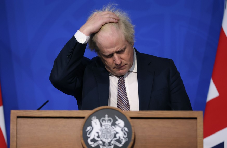 FILE- Britain&#039;s Prime Minister Boris Johnson gestures as he speaks during a press conference in London, Saturday Nov. 27, 2021, after cases of the new COVID-19 variant were confirmed in the UK. B ...