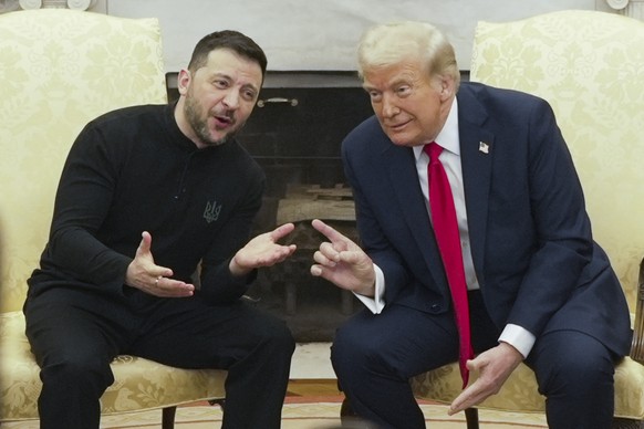 President Donald Trump, right, meets with Ukrainian President Volodymyr Zelenskyy in the Oval Office at the White House, Friday, Feb. 28, 2025, in Washington. (AP Photo/ Mystyslav Chernov)
Donald Trum ...