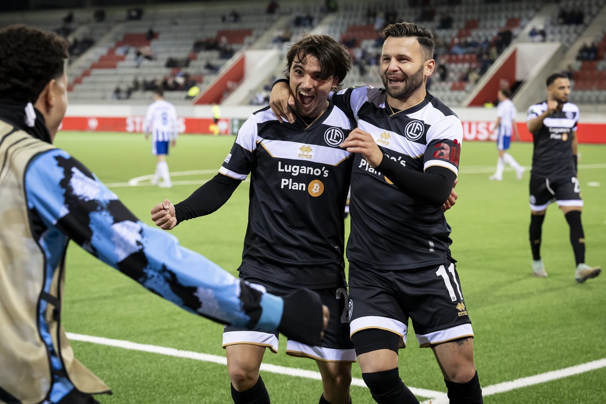 Lugano's Martim Marques, left, celebrates after scoring the 2-0 with Lugano's Renato Steffen, right, during the UEFA Conference League soccer match (League phase - Matchday 1) between Switze ...