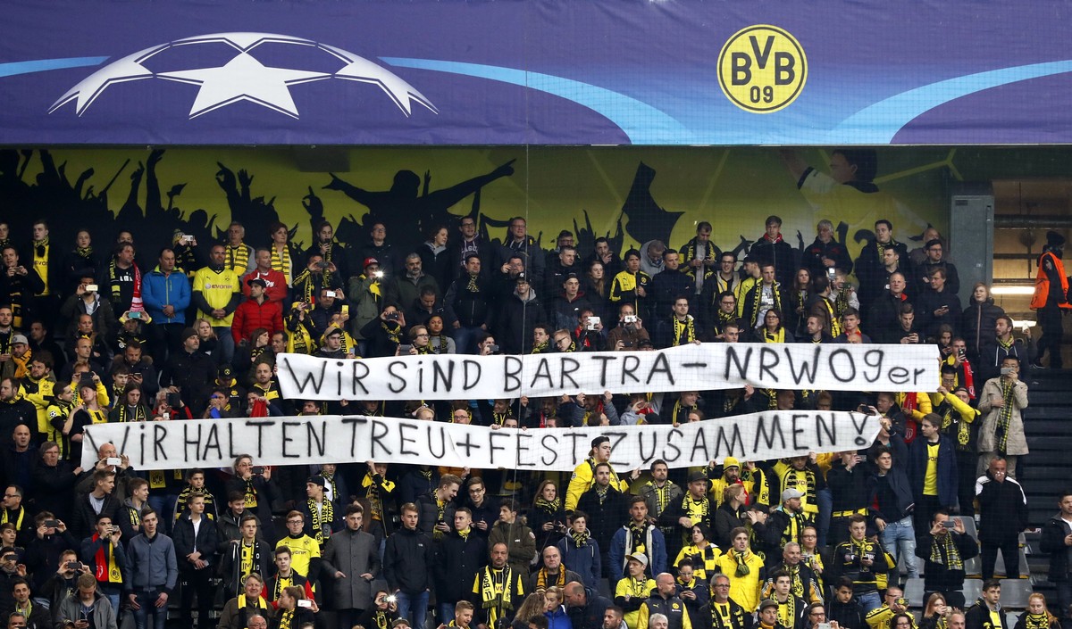 epa05904700 Borussia's supporters hold a banner reading 'We are Bartra, We stand together' prior to the UEFA Champions League quarter final, first leg soccer match between Borussia Dort ...
