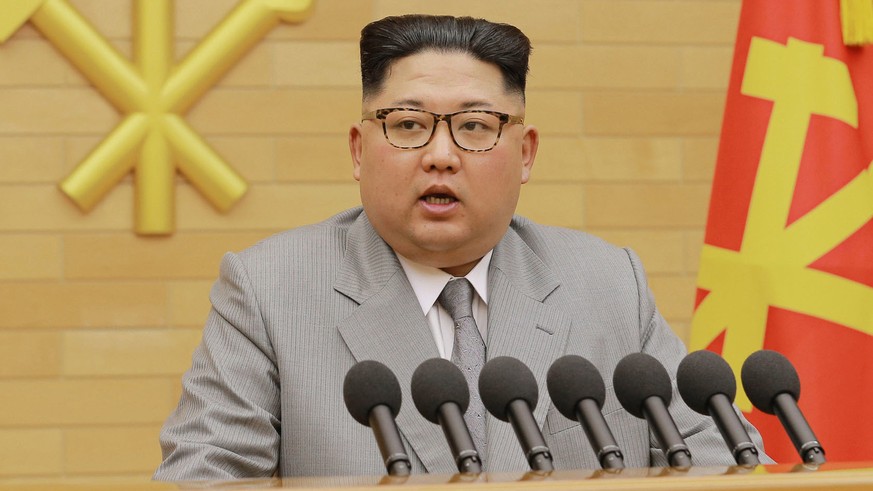 In this photo provided by the North Korean government, North Korean leader Kim Jong Un delivers his New Year&#039;s speech at an undisclosed place in North Korea Monday, Jan. 1, 2018. Kim said Monday  ...