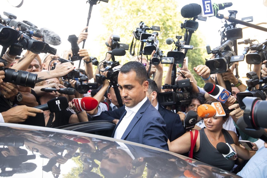 The political leader of the 5-Stars Movement, Italian Deputy Premier and Labor Minister, Luigi Di Maio, gets into his car at the end of the meeting with the staff of his party, in Rome, Monday, Aug. 2 ...