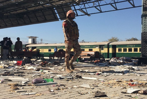 epa11710950 Pakistani security officials inspect the scene of a blast at a railway station in Quetta, the provincial capital of restive Balochistan province, Pakistan, 09 November 2024. An explosion a ...