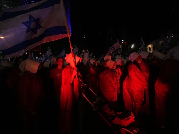Israeli women&#039;s rights activists dressed as characters in the popular television series, &quot;The Handmaid&#039;s Tale,&quot; protest plans by Prime Minister Benjamin Netanyahu&#039;s government ...