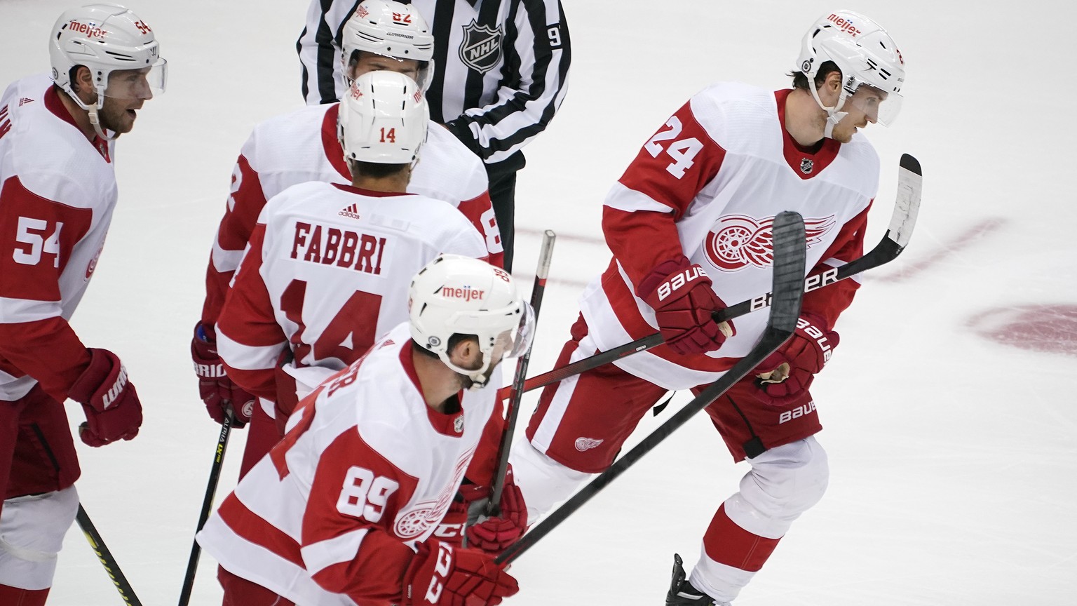 Detroit Red Wings&#039; Pius Suter (24) heads back to his bench after scoring during the period of a preseason NHL hockey game against the Pittsburgh Penguins in Pittsburgh, Sunday, Oct. 3, 2021. (AP  ...