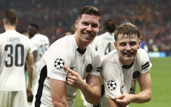 YB&#039;s Cedric Itten, left, and Lewin Blum celebrate their victory after the Uefa Champions League playoff soccer match between Turkey&#039;s Galatasaray Istanbul and Switzerland&#039;s BSC Young Bo ...