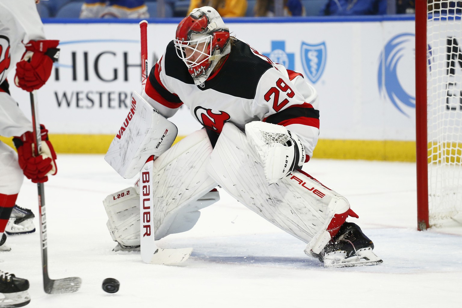 New Jersey Devils goaltender Mackenzie Blackwood (29) keeps his eyes on the puck during the first period of an NHL hockey game against the Buffalo Sabres, Wednesday, Dec. 29, 2021, in Buffalo, N.Y. (A ...