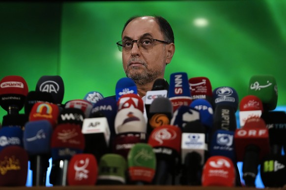 Vahid Haghanian, a longstanding senior official of the Iranian Supreme Leader&#039;s office, speaks with media after registering his name as a candidate for the June 28 presidential election at the In ...