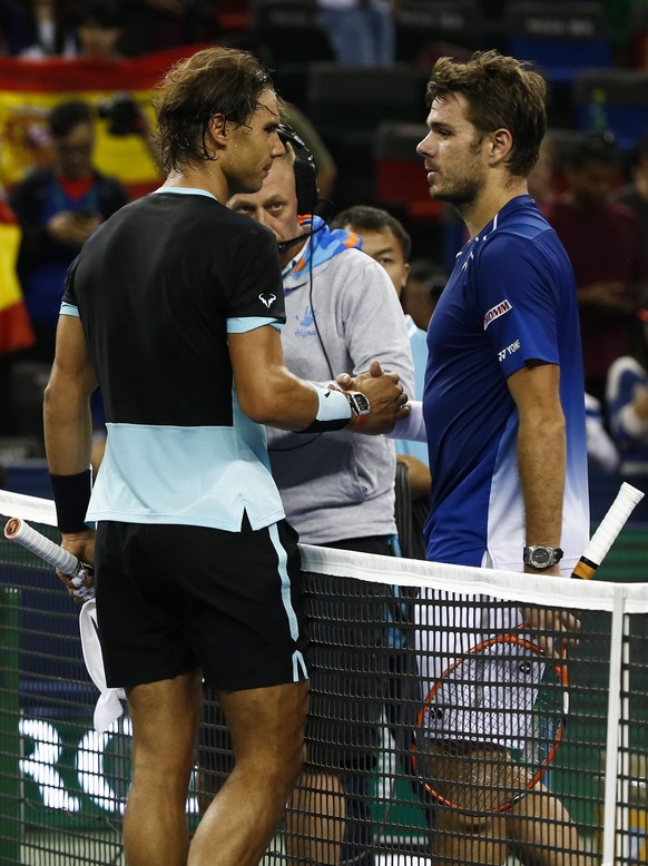 epa04979448 Victorious Rafael Nadal (L) of Spain and Stanislas Wawrinka (R) of Switzerland shake hands after the match in the Shanghai Tennis Masters at the Qi Zhong Tennis Center in Shanghai, China,  ...