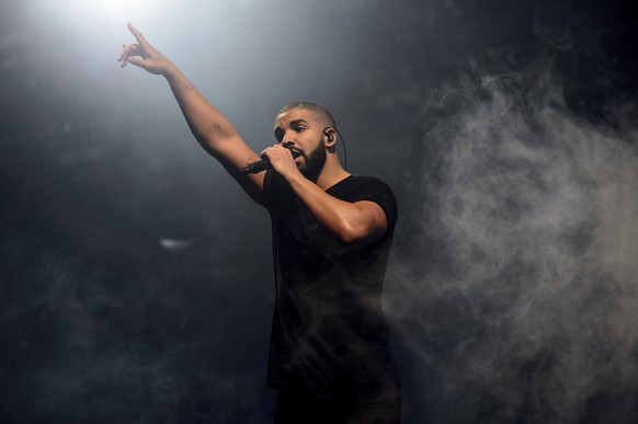 FILE - In this June 27, 2015 file photo, Drake performs on the main stage at Wireless festival in Finsbury Park, London. Drake could have offered Super Bowl week concertgoers just a few songs, but the ...