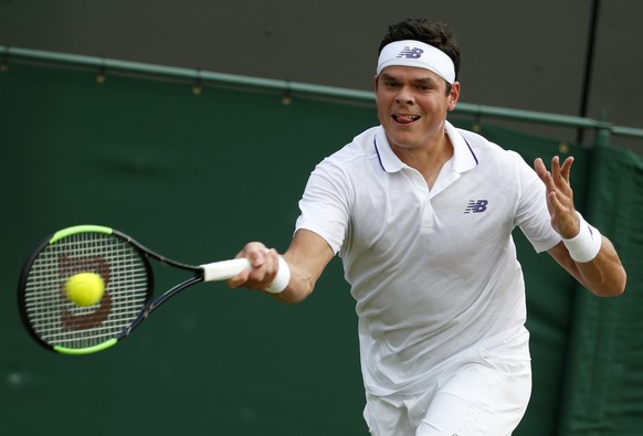 Canada&#039;s Milos Raonic returns the ball to Russia&#039;s Mikhail Youzhny during their Men&#039;s Singles Match on day four at the Wimbledon Tennis Championships in London Thursday, July 6, 2017. ( ...