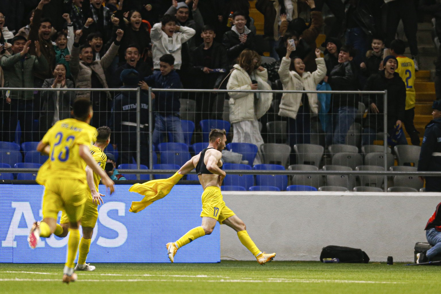 Kazakhstan&#039;s Abat Aimbetov, center, celebrates his side&#039;s third goal against Denmark&#039;s Denmark&#039;s goalkeeper Kasper Schmeichel during the Euro 2024 group H qualifying soccer match b ...