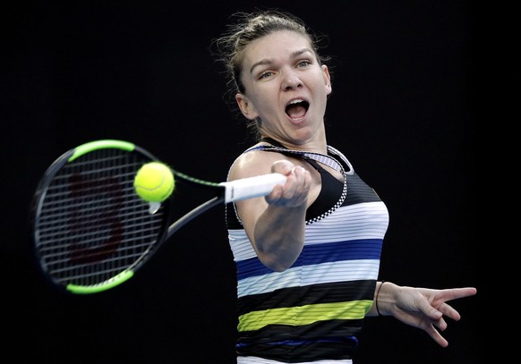 Romania&#039;s Simona Halep makes a forehand return to United States&#039; Serena Williams during their fourth round match at the Australian Open tennis championships in Melbourne, Australia, Monday,  ...