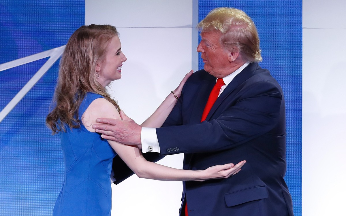 President Donald Trump, right, greets Natalie Harp, left, and invites her to speaks at the Faith &amp; Freedom Coalition conference in Washington, Wednesday, June 26, 2019. (AP Photo/Pablo Martinez Mo ...