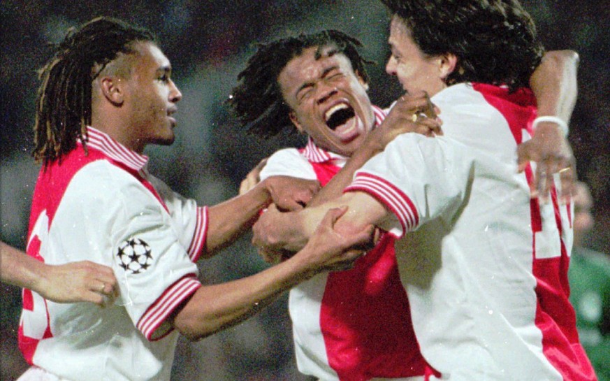Ajax players,from left,Kiki Musampa,Edgar Davids and Jaril Litmanen celebrate after scoring the decider during the semi-final match for Champions League against Panathinaikos in Athens Wednesday April ...