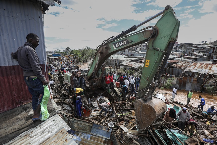 epa11317140 Locals of the Ngondo village, try to salvage some of their belongings as their houses get demolished by a government multiagency including the Kenyan military for being constructed along t ...
