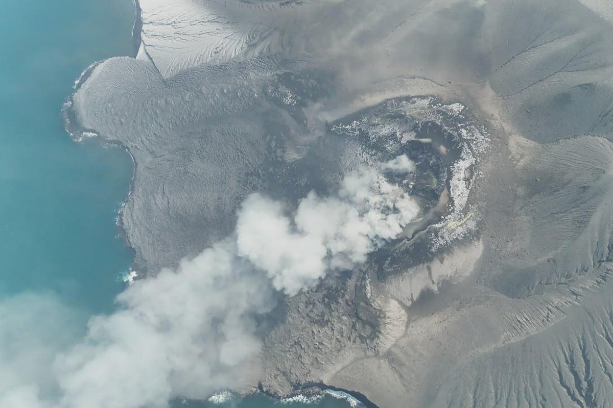 In this drone photo released by the Geological Agency (Badan Geologi) of Indonesia's Ministry of Energy and Mineral Resources, Mount Anak Krakatau spews volcanic smoke in Sunda Strait, Indonesia, ...