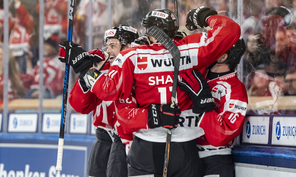 epa11796356 Team Canada players celebrates the 3-2 during the game between Team Canada and Straubing Tigers, at the 96th Spengler Cup ice hockey tournament in Davos, Switzerland, 28 December 2024. EPA ...