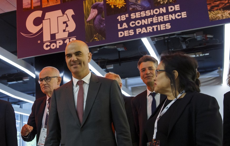 epa07777214 Swiss Interior Minister Alain Berset (L) and CITES Secretary-General Ivonne Higuero (R) arrive for the opening of the World Wildlife Conference - CITES CoP18, in Geneva, Switzerland, 17 Au ...